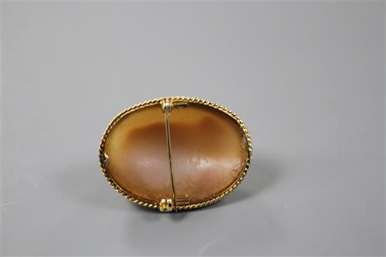 A modern 9ct gold mounted oval cameo brooch, carved with the bust of a lady to sinister,